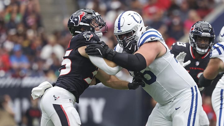 Oct 27, 2024; Houston, Texas, USA; Indianapolis Colts guard Quenton Nelson (56) blocks against Houston Texans linebacker Jake Hansen (35) during the game at NRG Stadium. Mandatory Credit: Troy Taormina-Imagn Images