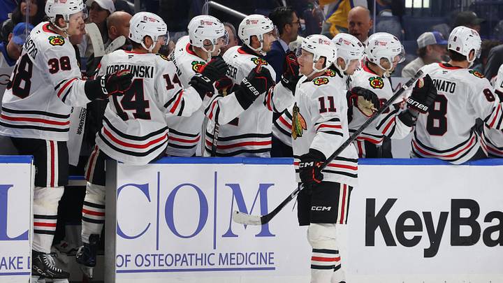 Chicago Blackhawks' Oliver Moore (11) celebrates his goal with teammates during the second period against the Buffalo Sabres at KeyBank Center. Mandatory Credit: Timothy T. Ludwig-Imagn Images