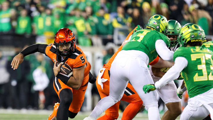 Oregon State Beavers quarterback DJ Uiagalelei holds on to the ball during the first half of the