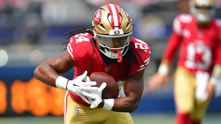 Sep 22, 2024; Inglewood, California, USA; San Francisco 49ers running back Jordan Mason (24) runs the ball against the Los Angeles Rams  rduring the first half at SoFi Stadium. Mandatory Credit: Gary A. Vasquez-Imagn Images