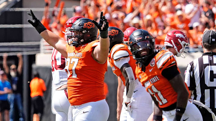 Oklahoma State's Justin Kirkland (97) celebrates a missed field goal by Arkansas in the first over time of the college football game between the Oklahoma State Cowboys and the Arkansas Razorbacks at Boone Pickens Stadium in Stillwater, Okla.,, Saturday, Sept., 7, 2024.