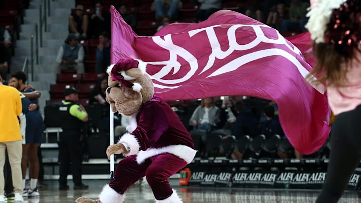 Mississippi State Bulldogs mascot Bully waves a flag during a time out during the first half against the Murray State Racers at Humphrey Coliseum. Mississippi State Bulldogs mascot Bully waves a flag during a time out during the first half against the Murray State Racers at Humphrey Coliseum.