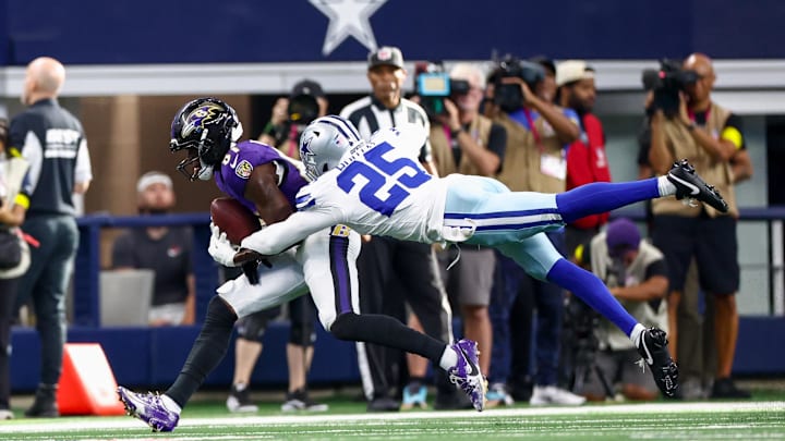 Baltimore Ravens wide receiver Devontez Walker makes a catch as Dallas Cowboys cornerback Andrew Booth defends. Mandatory Credit: Kevin Jairaj-Imagn Images