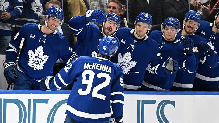 Oct 19, 2026; Toronto, Ontario, CAN;  Toronto Maple Leafs forward Gavin McKenna (92) celebrates with team mates at the bench after scoring a goal against the San Jose Sharks in the third period at Scotiabank Arena.  Mandatory Credit: Dan Hamilton-Imagn Images