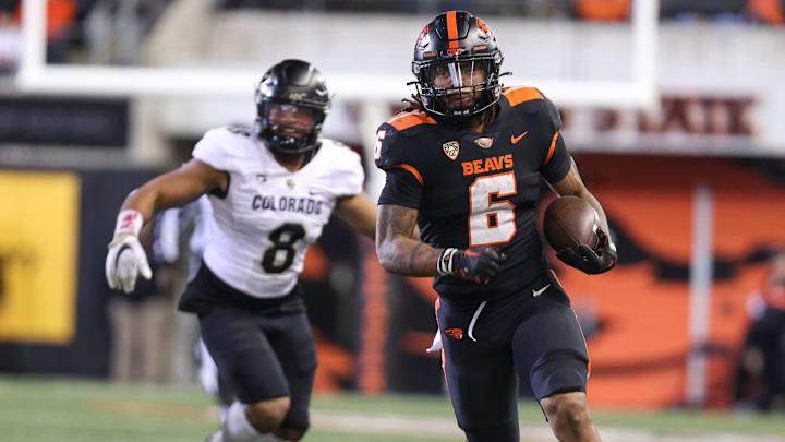 Oregon State running back Damien Martinez (6) carries the ball during the fourth quarter against