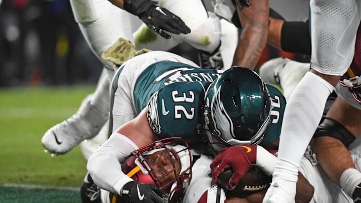 Nov 14, 2024; Philadelphia, Pennsylvania, USA; Washington Commanders running back Brian Robinson Jr. (8) scores a d against Philadelphia Eagles safety Reed Blankenship (32) during the first quarter at Lincoln Financial Field. Mandatory Credit: Eric Hartline-Imagn Images Nov 14, 2024; Philadelphia, Pennsylvania, USA; Washington Commanders running back Brian Robinson Jr. (8) scores a d against Philadelphia Eagles safety Reed Blankenship (32) during the first quarter at Lincoln Financial Field. Mandatory Credit: Eric Hartline-Imagn Images