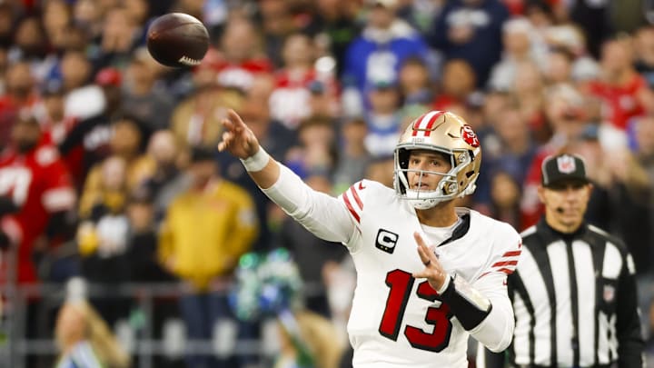 Oct 10, 2024; Seattle, Washington, USA; San Francisco 49ers quarterback Brock Purdy (13) passes against the Seattle Seahawks during the second quarter at Lumen Field. Mandatory Credit: Joe Nicholson-Imagn Images