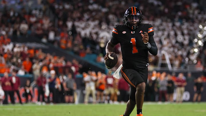 Oct 26, 2024; Miami Gardens, Florida, USA; Miami Hurricanes quarterback Cam Ward (1) runs with the football against the Florida State Seminoles during the second quarter at Hard Rock Stadium. Mandatory Credit: Sam Navarro-Imagn Images