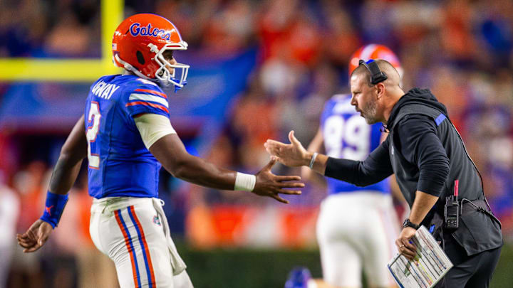 Florida Gators quarterback DJ Lagway (2) is congratulated by Florida Gators head coach Billy Napier after a series during the first half at Ben Hill Griffin Stadium in Gainesville, FL on Saturday, October 19, 2024 against the Kentucky Wildcats. [Doug Engle/Gainesville Sun]