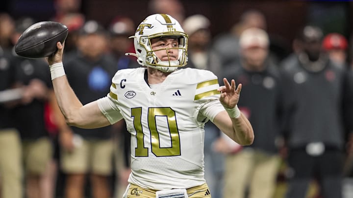 Nov 28, 2025; Atlanta, Georgia, USA; Georgia Tech Yellow Jackets quarterback Haynes King (10) passes the ball against the Georgia Bulldogs during the first half at Mercedes-Benz Stadium. Mandatory Credit: Dale Zanine-Imagn Images