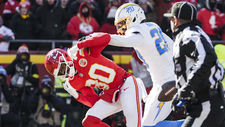 Dec 14, 2025; Kansas City, Missouri, USA; Los Angeles Chargers cornerback Cam Hart (20) breaks up a pass intended for Kansas City Chiefs wide receiver Tyquan Thornton (80) during the second quarter at GEHA Field at Arrowhead Stadium. Mandatory Credit: Denny Medley-Imagn Images Dec 14, 2025; Kansas City, Missouri, USA; Los Angeles Chargers cornerback Cam Hart (20) breaks up a pass intended for Kansas City Chiefs wide receiver Tyquan Thornton (80) during the second quarter at GEHA Field at Arrowhead Stadium. Mandatory Credit: Denny Medley-Imagn Images