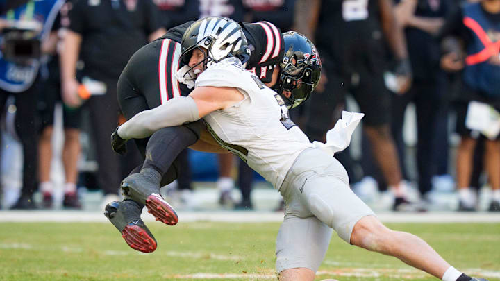 Oregon defensive back Dillon Thieneman, right, brings down Texas Tech quarterback Behren Morton as the Oregon Ducks take on the Texas Tech Red Raiders in the Orange Bowl on Jan. 1, 2026, at Hard Rock Stadium in Miami, Florida.