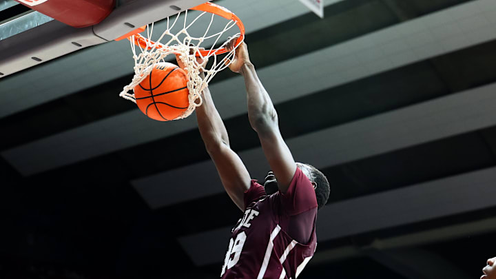 Mississippi State Bulldogs forward Achor Achor (99) dunks the ball during the second half against the Alabama Crimson Tide at Coleman Coliseum. Mississippi State Bulldogs forward Achor Achor (99) dunks the ball during the second half against the Alabama Crimson Tide at Coleman Coliseum.
