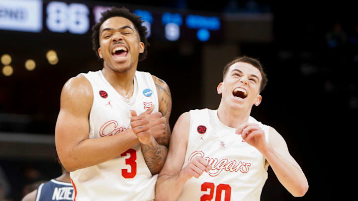 Houston's Ramon Walker Jr. (3) and Ryan Elvin (20) celebrate after win