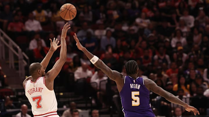 Mar 18, 2026; Houston, Texas, USA; Houston Rockets forward Kevin Durant (7) makes a three point basket against Los Angeles Lakers center Deandre Ayton (5) in the second half at Toyota Center. Mandatory Credit: Thomas Shea-Imagn Images