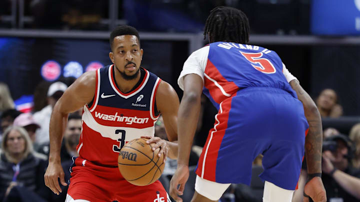 Nov 10, 2025; Detroit, Michigan, USA;  Washington Wizards guard CJ McCollum (3) dribbles defended by Detroit Pistons forward Ronald Holland II (5) in the first half at Little Caesars Arena. Mandatory Credit: Rick Osentoski-Imagn Images