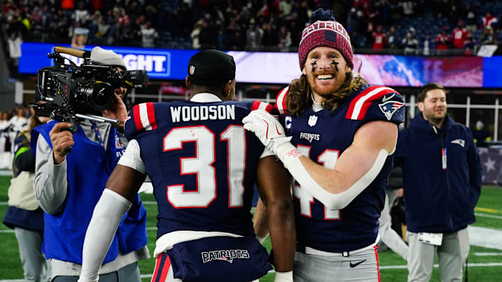 Jan 11, 2026; Foxborough, MA, USA; New England Patriots safety Brenden Schooler (41) and safety Craig Woodson (31) celebrate after defeating the Los Angeles Chargers in an AFC Wild Card Round game at Gillette Stadium. Mandatory Credit: David Butler II-Imagn Images