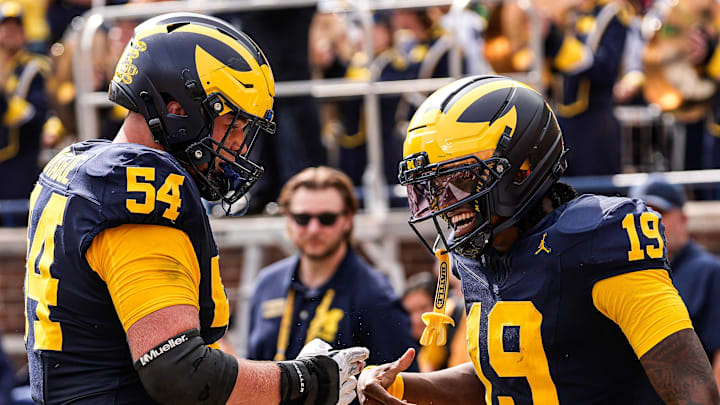Michigan quarterback Bryce Underwood (19) celebrates a touchdown against Central Michigan with offensive lineman Andrew Sprague (54) during the second half at Michigan Stadium in Ann Arbor on Saturday, Sept. 13, 2025.