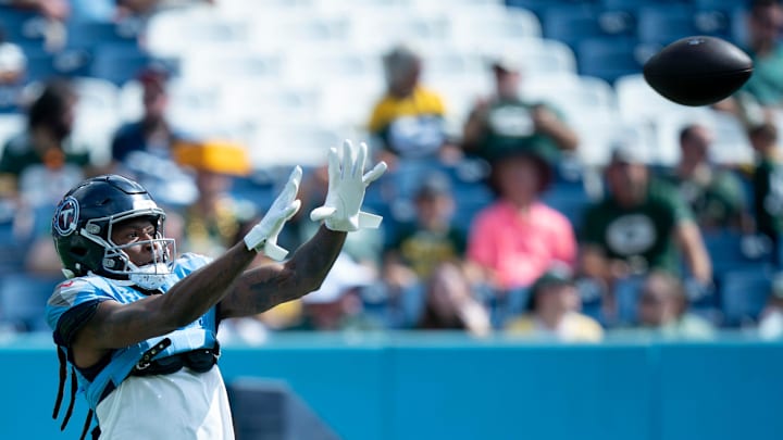 Tennessee Titans wide receiver DeAndre Hopkins (10) grabs a pass during warmups before their game against the Green Bay Packers at Nissan Stadium in Nashville, Tenn., Sunday, Sept. 22, 2024.