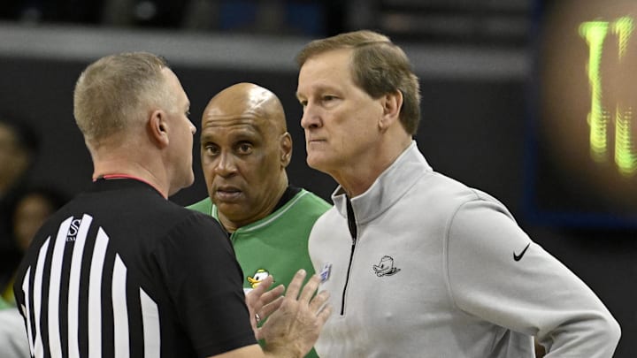 Jan 30, 2025; Los Angeles, California, USA;  Oregon Ducks head coach Dana Altman, right, talks with a referee during the first half against the UCLA Bruins at Pauley Pavilion presented by Wescom. Mandatory Credit: Alex Gallardo-Imagn Images