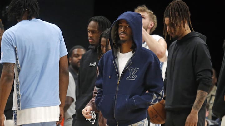 Jan 11, 2026; Memphis, Tennessee, USA; Memphis Grizzlies guard Ja Morant (12) looks on during a timeout during the first quarter against the Brooklyn Nets at FedExForum. 
