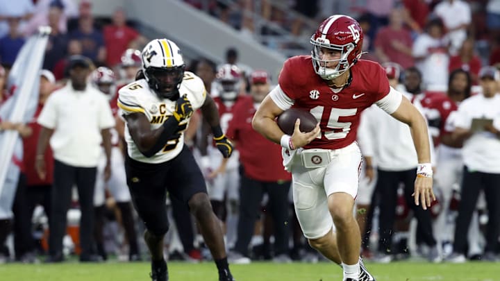 Oct 26, 2024; Tuscaloosa, Alabama, USA;  Alabama Crimson Tide quarterback Ty Simpson (15) scrambles for a first down against the Missouri Tigers during the second half at Bryant-Denny Stadium. Mandatory Credit: Butch Dill-Imagn Images
