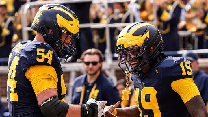 Michigan quarterback Bryce Underwood (19) celebrates a touchdown against Central Michigan with offensive lineman Andrew Sprague (54) during the second half at Michigan Stadium in Ann Arbor on Saturday, Sept. 13, 2025. Michigan quarterback Bryce Underwood (19) celebrates a touchdown against Central Michigan with offensive lineman Andrew Sprague (54) during the second half at Michigan Stadium in Ann Arbor on Saturday, Sept. 13, 2025.