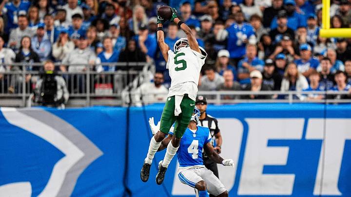 New York Jets wide receiver Garrett Wilson (5) makes a catch against Detroit Lions cornerback D.J. Reed (4) during the second half at Ford Field in Detroit on Sunday, Sept. 27, 2026. New York Jets wide receiver Garrett Wilson (5) makes a catch against Detroit Lions cornerback D.J. Reed (4) during the second half at Ford Field in Detroit on Sunday, Sept. 27, 2026.