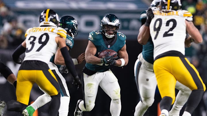 Dec 15, 2024; Philadelphia, Pennsylvania, USA; Philadelphia Eagles running back Saquon Barkley (26) runs with the ball against the Pittsburgh Steelers during the fourth quarter at Lincoln Financial Field. Mandatory Credit: Bill Streicher-Imagn Images
