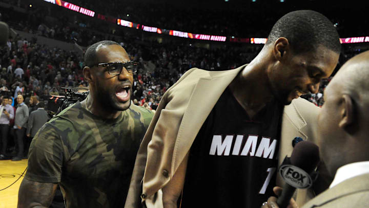 Dec 28, 2013; Portland, OR, USA; Miami Heat small forward LeBron James (left) celebrates with center Chris Bosh (1) after Bosh hit the game winning shot against the Portland Trail Blazers at the Moda Center. The Heat won the game 108-107. Mandatory Credit: Steve Dykes-Imagn Images