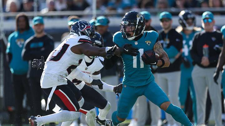 Dec 1, 2024; Jacksonville, Florida, USA; Jacksonville Jaguars wide receiver Parker Washington (11) is pressured by Houston Texans safety Jimmie Ward (20) in the third quarter at EverBank Stadium. Mandatory Credit: Nathan Ray Seebeck-Imagn Images