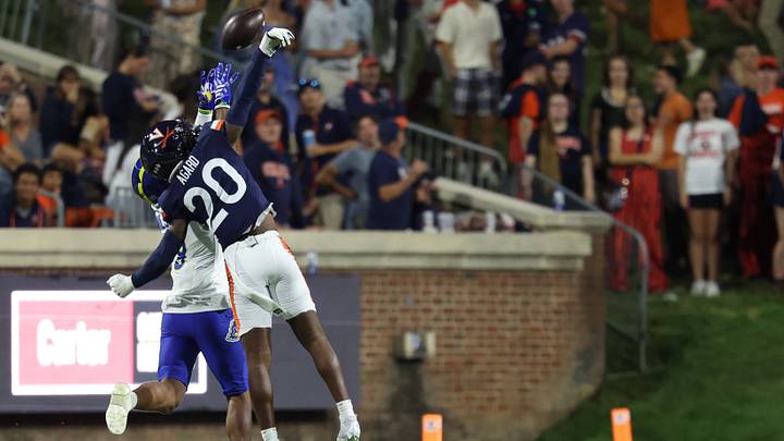 Sep 26, 2026; Charlottesville, Virginia, USA; Virginia Cavaliers cornerback Omillio Agard (20) breaks up a pass intended for Delaware Blue Hens wide receiver Sean Wilson (18) at Scott Stadium. Mandatory Credit: Geoff Burke-Imagn Images Sep 26, 2026; Charlottesville, Virginia, USA; Virginia Cavaliers cornerback Omillio Agard (20) breaks up a pass intended for Delaware Blue Hens wide receiver Sean Wilson (18) at Scott Stadium. Mandatory Credit: Geoff Burke-Imagn Images