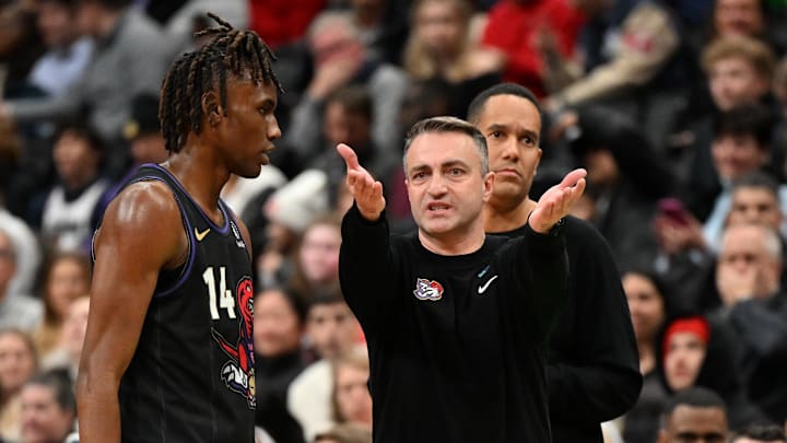 fJan 21, 2025; Toronto, Ontario, CAN; Toronto Raptors head coach Darko Rajakovic speaks with guard Ja'Kobe Walter (14) as assistant coach Jama Mahlalela looks on in the second half against the Orlando Magic at Scotiabank Arena. Mandatory Credit: Dan Hamilton-Imagn Images fJan 21, 2025; Toronto, Ontario, CAN; Toronto Raptors head coach Darko Rajakovic speaks with guard Ja'Kobe Walter (14) as assistant coach Jama Mahlalela looks on in the second half against the Orlando Magic at Scotiabank Arena. Mandatory Credit: Dan Hamilton-Imagn Images