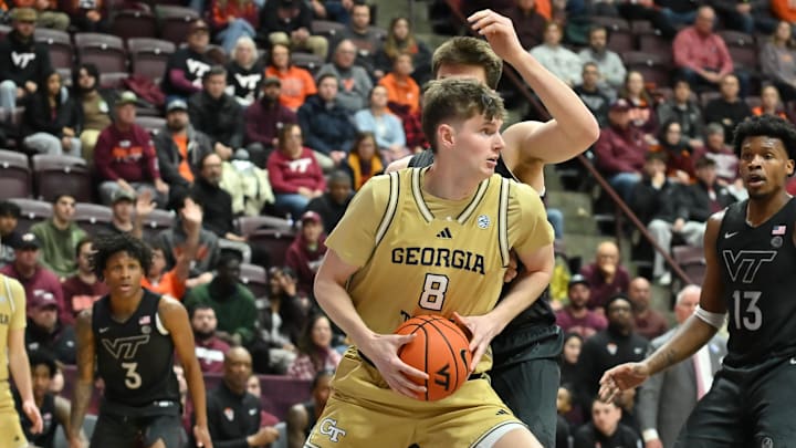 Jan 27, 2026; Blacksburg, Virginia, USA;  Georgia Tech Yellow Jackets center Cole Kirouac (8) looks to pass the ball during the first half at Cassell Coliseum. Mandatory Credit: Brian Bishop-Imagn Images