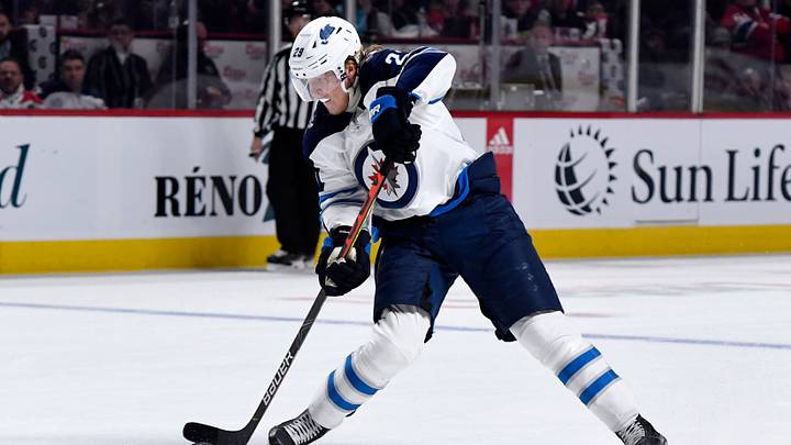 Winnipeg Jets forward Patrick Laine (29) shoots the puck during the third period of the game against the Montreal Canadiens at the Bell Centre. Mandatory Credit: Eric Bolte-USA TODAY Sports Winnipeg Jets forward Patrick Laine (29) shoots the puck during the third period of the game against the Montreal Canadiens at the Bell Centre. Mandatory Credit: Eric Bolte-USA TODAY Sports