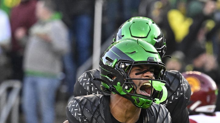 Nov 22, 2025; Eugene, Oregon, USA; Oregon Ducks tight end Kenyon Sadiq (18) celebrates against the Southern California Trojans during the second half at Autzen Stadium. Mandatory Credit: Troy Wayrynen-Imagn Images