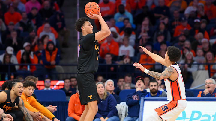 Dec 2, 2025; Syracuse, New York, USA; Tennessee Volunteers forward Nate Ament (10) shoots against Syracuse Orange guard Naithan George (11) during the second half at the JMA Wireless Dome. Mandatory Credit: Rich Barnes-Imagn Images