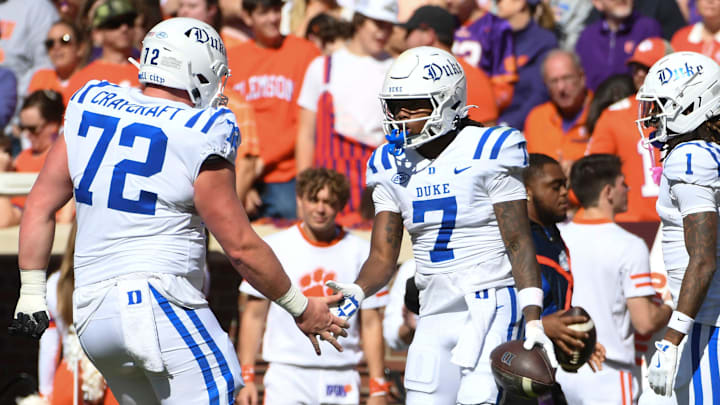 Duke Blue Devils wide receiver Que'Sean Brown (7) celebrates with Duke Blue Devils offensive lineman Matt Craycraft (72) and Duke Blue Devils safety Terry Moore (1) after scoring a touchdown Saturday, Nov. 1, 2025, during the NCAA football game at Memorial Stadium in Clemson, South Carolina. Duke Blue Devils wide receiver Que'Sean Brown (7) celebrates with Duke Blue Devils offensive lineman Matt Craycraft (72) and Duke Blue Devils safety Terry Moore (1) after scoring a touchdown Saturday, Nov. 1, 2025, during the NCAA football game at Memorial Stadium in Clemson, South Carolina.