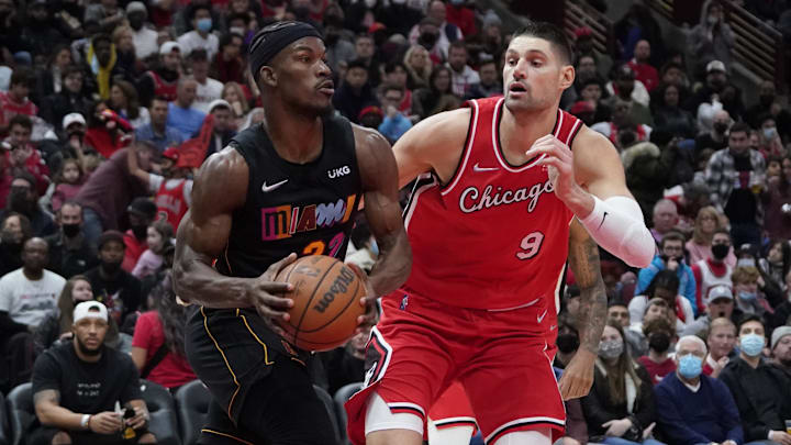 Nov 27, 2021; Chicago, Illinois, USA; Miami Heat forward Jimmy Butler (22) is defended by Chicago Bulls center Nikola Vucevic (9) during the second half at United Center. Mandatory Credit: David Banks-Imagn Images Nov 27, 2021; Chicago, Illinois, USA; Miami Heat forward Jimmy Butler (22) is defended by Chicago Bulls center Nikola Vucevic (9) during the second half at United Center. Mandatory Credit: David Banks-Imagn Images