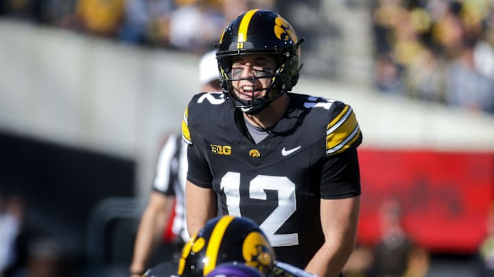 Iowa’s Cade McNamara (12) calls a play at the line of scrimmage against Northwestern Saturday, Oct. 26, 2024 at Kinnick Stadium in Iowa City, Iowa. Iowa’s Cade McNamara (12) calls a play at the line of scrimmage against Northwestern Saturday, Oct. 26, 2024 at Kinnick Stadium in Iowa City, Iowa.
