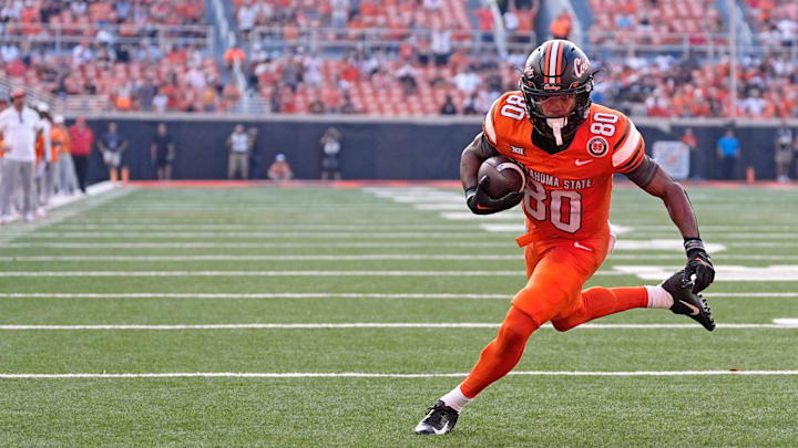 Oklahoma State's Brennan Presley (80) scores a 2-point conversion in the second half of the college football between the Oklahoma State University Cowboys and the Utah Utes at Boone Pickens Stadium in Stillwater, Okla., Saturday, Sept., 21, 2024.