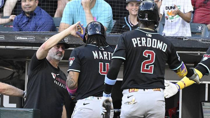 Jun 23, 2025; Chicago, Illinois, USA; Arizona Diamondbacks second baseman Ketel Marte (4) high fives manager Torey Lovullo (17) after scoring during the first inning against the Chicago White Sox at Rate Field. Mandatory Credit: Matt Marton-Imagn Images Jun 23, 2025; Chicago, Illinois, USA; Arizona Diamondbacks second baseman Ketel Marte (4) high fives manager Torey Lovullo (17) after scoring during the first inning against the Chicago White Sox at Rate Field. Mandatory Credit: Matt Marton-Imagn Images