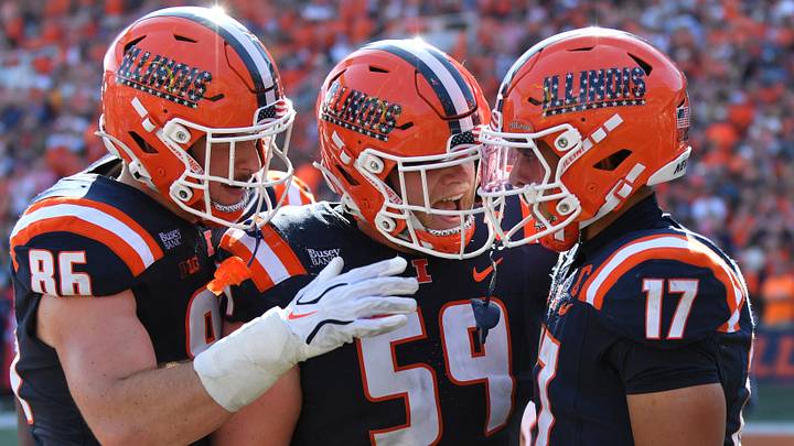Sep 12, 2026; Champaign, Illinois, USA;  Illinois Fighting Illini tight end Christian Abney (86) and Jake Renfro (59) react with wide receiver Collin Dixon (17) after he scored a touchdown during the first half at against the Duke Blue Devils at Gies Memorial Stadium.  Mandatory Credit: Ron Johnson-Imagn Images