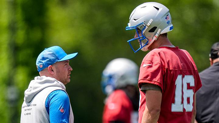 Detroit Lions offensive coordinator Drew Petzing, left, talks to quarterback Jared Goff during OTAs at Meijer Performance Center in Allen Park on Thursday, June 4, 2026.