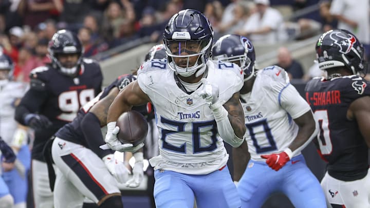 Nov 24, 2024; Houston, Texas, USA; Tennessee Titans running back Tony Pollard (20) runs with the ball during the second quarter against the Houston Texans at NRG Stadium. Mandatory Credit: Troy Taormina-Imagn Images