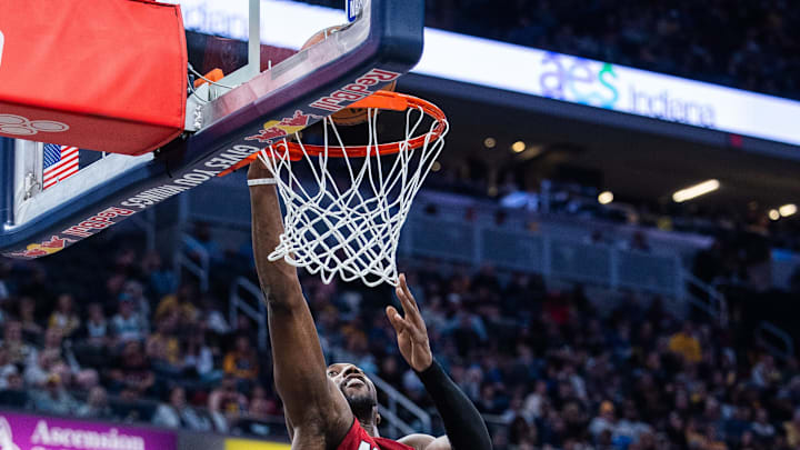 Nov 17, 2024; Indianapolis, Indiana, USA; Miami Heat center Bam Adebayo (13) shoots the ball while Indiana Pacers center Myles Turner (33) defends in the second half at Gainbridge Fieldhouse. Mandatory Credit: Trevor Ruszkowski-Imagn Images