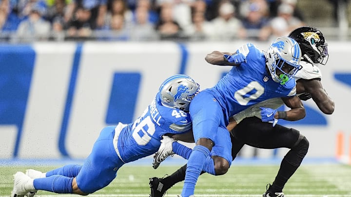 Nov 17, 2024; Detroit, MI, USA; Jacksonville Jaguars wide receiver Brian Thomas Jr. (7) is forced out of bound by Detroit Lions cornerback Terrion Arnold (0) and linebacker Jack Campbell (46) during the first half at Ford Field in Detroit on Sunday, Nov. 17, 2024. Mandatory Credit: Junfu Han/USA TODAY Network via Imagn Images 
