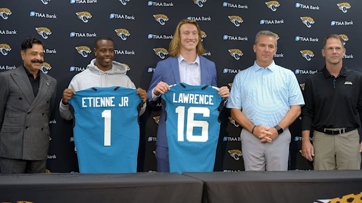 Jaguars first-round draft pick Trevor Lawrence along with team owner Shad Khan, head coach Urban Meyer and general manager Trent Baalke are pictured at Lawrence's introductory press conference.