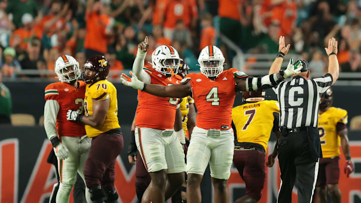 Sep 6, 2025; Miami Gardens, Florida, USA; Miami Hurricanes defensive lineman Rueben Bain Jr. (4) reacts after a sack against the Bethune-Cookman Wildcats during the third quarter at Hard Rock Stadium. Mandatory Credit: Sam Navarro-Imagn Images