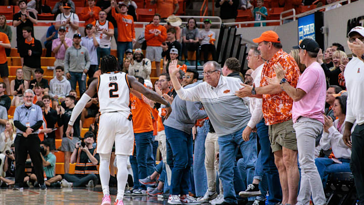 Feb 25, 2025; Stillwater, Oklahoma, USA; Oklahoma State Cowboys guard Arturo Dean (2) reacts with fans after a play during the second half against the Iowa State Cyclones at Gallagher-Iba Arena. Mandatory Credit: William Purnell-Imagn Images